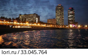 Famous Barceloneta beach on Mediterranean in Barcelona in evening dusk (2019 год). Редакционное видео, видеограф Яков Филимонов / Фотобанк Лори
