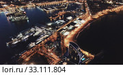 View from drone of illuminated Barceloneta beach with Port Vell t night (2019 год). Стоковое видео, видеограф Яков Филимонов / Фотобанк Лори