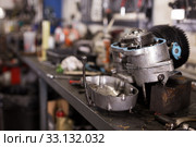 Empty workshop for motorbike repair with table with different tools. Стоковое фото, фотограф Яков Филимонов / Фотобанк Лори