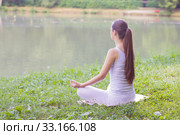 Yoga Woman Meditating Relaxing Healthy Lifestyle. Стоковое фото, фотограф Mitar gavric / PantherMedia / Фотобанк Лори