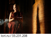 Buddhist novices learning. Стоковое фото, фотограф Wong Sze Fei / PantherMedia / Фотобанк Лори