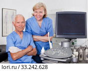Qualified doctors near modern ultrasound machine. Стоковое фото, фотограф Яков Филимонов / Фотобанк Лори