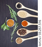 Colorful spices and wooden cutlery. Стоковое фото, фотограф Erika Eros / Smarterpix / Фотобанк Лори
