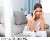 Sick female holding hands on her head. Стоковое фото, фотограф Яков Филимонов / Фотобанк Лори