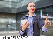 Adult woman with tablet pointing finger on air. Стоковое фото, фотограф Яков Филимонов / Фотобанк Лори