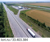 White semi trailer truck driving on straight highway to pertol station. view from above. The Don M4 route in Russia. Стоковое фото, фотограф Кекяляйнен Андрей / Фотобанк Лори
