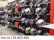 Motorcycle outfit as helmets is in the Allright shop in Vantaa retail park. It is store with motorcycles and racing equipment selling (2018 год). Редакционное фото, фотограф Кекяляйнен Андрей / Фотобанк Лори