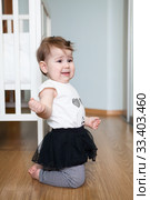 Little capricious child standing on floor of domestic room, screaming and crying. Girl behaves badly. Стоковое фото, фотограф Кекяляйнен Андрей / Фотобанк Лори