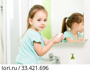Little girl washing hands and showing soapy palms. Стоковое фото, фотограф Оксана Кузьмина / Фотобанк Лори