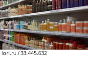 Various of haircare cosmetics and wigs for sale on shelves of specialty cosmetic shop (2020 год). Редакционное видео, видеограф Яков Филимонов / Фотобанк Лори