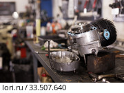 Empty workshop for motorbike repair with table with different tools. Стоковое фото, фотограф Яков Филимонов / Фотобанк Лори