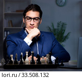 Businessman playing chess in strategy concept. Стоковое фото, фотограф Elnur / Фотобанк Лори