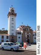 Building and tower of the Basilica of the Royal Marian Shrine of Our Lady of Candelaria. View from square the Plaza de la Patrona de Canarias. Тенерифе, Канары, Испания (2016 год). Редакционное фото, фотограф Кекяляйнен Андрей / Фотобанк Лори