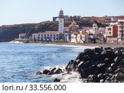 The Basilica of the Royal Marian Shrine of Our Lady of Candelaria with shoreline. The Candelaria town is a popular touristic place for visiting. Tenerife, Canary island, Spain (2016 год). Стоковое фото, фотограф Кекяляйнен Андрей / Фотобанк Лори