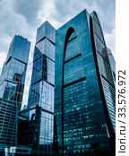 Moscow, Russia - September 24, 2016: Awesome modern glass skyscrapers in the Business centerBlue skyscraper facade. office buildings. modern glass silhouettes of skyscrapers. Редакционное фото, фотограф Андрей Зык / Фотобанк Лори