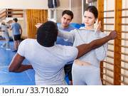 People fighting with coach at gym. Стоковое фото, фотограф Яков Филимонов / Фотобанк Лори