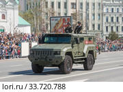 Российский бронированный автомобиль повышенной защищённости «Тайфуненок» КамАЗ-53949 с экипаже идет после парада в честь Дня Победы по Арбату в Москве (2018 год). Редакционное фото, фотограф Малышев Андрей / Фотобанк Лори