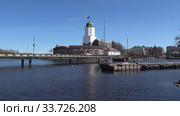 Выборгский замок в городском пейзаже солнечным майским днем. Россия (2020 год). Стоковое видео, видеограф Виктор Карасев / Фотобанк Лори