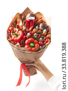 A large bouquet created from smoked sausages, cheese, paprika and bread wrapped in craft paper in a woman's hand on. Стоковое фото, фотограф Олег Белов / Фотобанк Лори