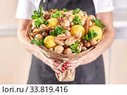 A large beautiful fruit bouquet of lemons, nuts, ginger and mint in the hands of a woman florist. Стоковое фото, фотограф Олег Белов / Фотобанк Лори