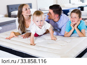 Little funny boy crawling on bed in salon. Стоковое фото, фотограф Яков Филимонов / Фотобанк Лори