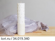 Handmade cylindrical shape candle with rhinestones. Стоковое фото, фотограф Nataliia Zhekova / Фотобанк Лори