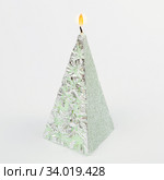 Decorative Handmade candle in the shape of a pyramid on white. Стоковое фото, фотограф Nataliia Zhekova / Фотобанк Лори