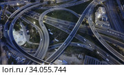 Aerial view of lighted highway road junctions at night. Стоковое видео, видеограф Яков Филимонов / Фотобанк Лори