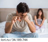 Man suffering from impotency with pill. Стоковое фото, фотограф Elnur / Фотобанк Лори