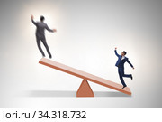 Competition concept with businessman and seesaw. Стоковое фото, фотограф Elnur / Фотобанк Лори