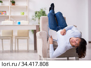 Young male student preparing for exams at home. Стоковое фото, фотограф Elnur / Фотобанк Лори