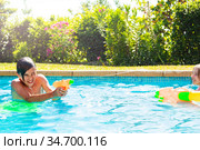 Cute Boy in swimming pool shooting with water. Стоковое фото, фотограф Сергей Новиков / Фотобанк Лори