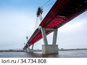 Russia, Blagoveshchensk, July 2019: Bridge on the Amur river from Blagoveshchensk to the Chinese city of Heihe in summer. Стоковое фото, фотограф Катерина Белякина / Фотобанк Лори