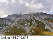 Unapproachable mountain peak hidden by clouds. Стоковое фото, фотограф Евгений Харитонов / Фотобанк Лори