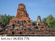 На руинах древнего буддистского храма Wat Phra Pai Luang солнечным днем. Сукхотай, Таиланд (2016 год). Стоковое фото, фотограф Виктор Карасев / Фотобанк Лори