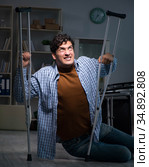 Man fell off wheelchair sitting on the floor. Стоковое фото, фотограф Elnur / Фотобанк Лори