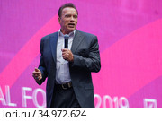 Arnold Schwarzenegger, famous actor, politician and businessman, speaks at a business forum (2019 год). Редакционное фото, фотограф Антон Гвоздиков / Фотобанк Лори