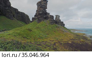 Two Brothers rocks on the shore of the Barents sea on the Sredny Peninsula. Murmansk region, Russia. Стоковое видео, видеограф Aleksandr Lutcenko / Фотобанк Лори