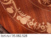 Decorative inlay carving on a wooden table. Стоковое фото, фотограф EugeneSergeev / Фотобанк Лори