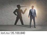 Concept of businessman liar with his shadow. Стоковое фото, фотограф Elnur / Фотобанк Лори