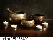 Set of Tibetan singing bowls with candles. Стоковое фото, фотограф Алексей Кузнецов / Фотобанк Лори
