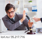 Lawyer being offered bribe for his services. Стоковое фото, фотограф Elnur / Фотобанк Лори
