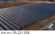 Солнечная электростанция в горном Алтае. Вид с воздуха. Solar power plant in the Altai Mountains. Aerial view. Стоковое видео, видеограф Евгений Романов / Фотобанк Лори
