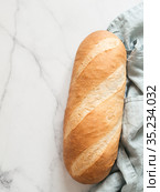 British White Bloomer or Baton loaf bread. Стоковое фото, фотограф Ольга Сергеева / Фотобанк Лори