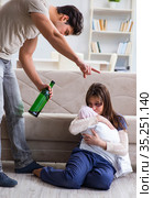 Domestic violence concept with drinking husband man. Стоковое фото, фотограф Elnur / Фотобанк Лори