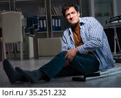 Man fell off wheelchair sitting on the floor. Стоковое фото, фотограф Elnur / Фотобанк Лори