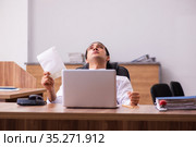 Young male employee unhappy with office prank in the office. Стоковое фото, фотограф Elnur / Фотобанк Лори