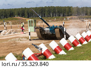 Moscow region, Alabino landfill. International Army Games-2020. Tank biathlon. T-72B3 tank with Uzbek crew overcomes the pit obstacle. Public event. Редакционное фото, фотограф Наталья Волкова / Фотобанк Лори