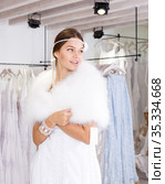 Woman flaunting dressed in wedding gown. Стоковое фото, фотограф Яков Филимонов / Фотобанк Лори