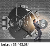 Businessman robbing bank in financial crime concept. Стоковое фото, фотограф Elnur / Фотобанк Лори